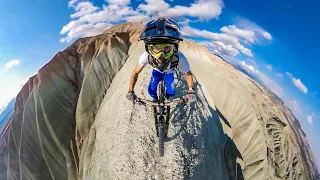 Cycling on Knife Back at 200 Meters Height