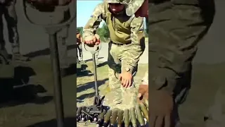 Ukranian Troops ready an ammo belt for the ZU-23 Fixed AA gun