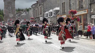 Chieftain leads the massed pipe bands parade through Dufftown to the 2022 Dufftown Highland Games