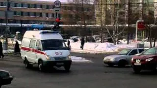 Russian ambulance responding through red light with lights and sirens