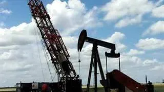 Cooper Workover Rig Raising Derrick On Oil Well Pt.1