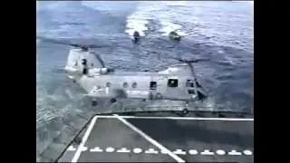 Helicopter crashes into aircraft carrier then sinks