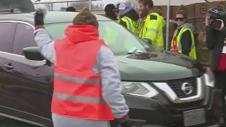 Food giveaway draws thousands in north St. Louis