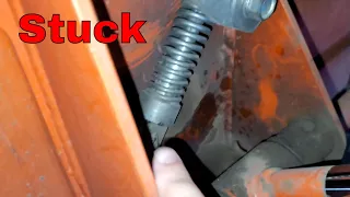 Removing a stuck quick disconnect Loader on a tractor