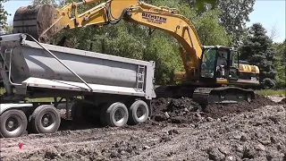 Cat 330C Excavator Loading A Dump Truck