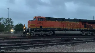 BNSF 7661 leads empty grain train