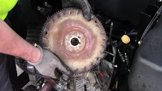 Flywheel removal on a 23hp Kawasaki engine; no puller needed.