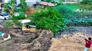 Wow !! Looks interesting! Dozer pushes small forests and rocks buried in rubbish to create new dams.