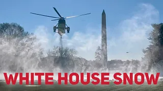 Marine One kicks up the snow at the White House landing zone.