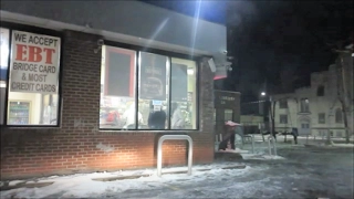 INSIDE A GHETTO GAS STATION AT NIGHT ON DETROIT'S EAST SIDE