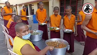 serving food to monks at namdroling monastery
