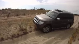 Pajero IV over small sand hill