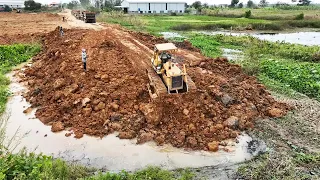 Good Skills Operator Bulldozer Pushing Clearing Sticker Dirt And 12 Wheel Dump Truck Unloading