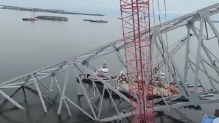 Salvage teams prepare to remove section of bridge from atop Dali