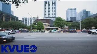 Live look: Crews cleaning up tents outside Austin City Hall | KVUE