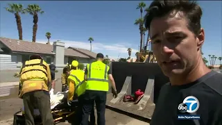 Rescuers use front loader to move elderly residents trapped in Cathedral City care home during storm