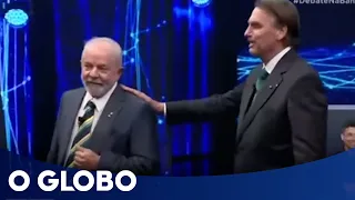 Bolsonaro põe a mão no ombro de Lula, que o chama de 'puxa-saco' | Debate na Band