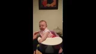 Baby tries peas for the first time