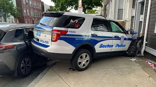 Police cruiser crashes into building that houses Boston barbershop