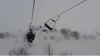 Skiers stranded on chairlifts survive STRONG winds