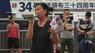 The Hong Kong activist who kept fighting after her husband's arrest | AFP