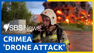 Crimea fuel tank on fire following 'drone attack' by Ukrainian forces | SBS News