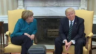 Trump​ appears to ignore requests for a handshake with Angela Merkel​