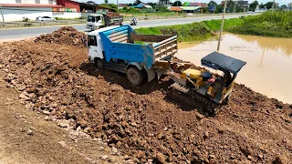 Fantastic, original construction At new road border, KOMATSU Dozers D20P & truck are spreading soil