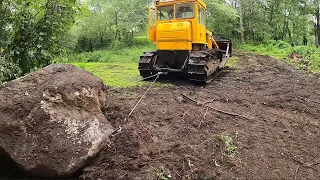 Moving a giant boulder with a bulldozer