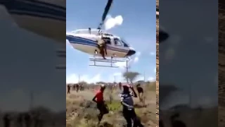 A Man in Ukambani hangs on a helicopter as it takes off, what follows is Disturbing