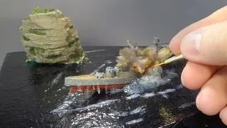 DIORAMA WITH A SINKING SHIP.