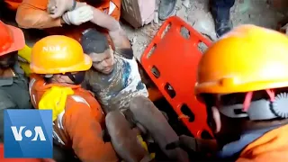 Rescuers Search Rubble of Collapsed Building in India