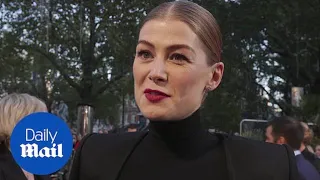 Rosamund Pike exudes gothic glamour at the A Private War premiere