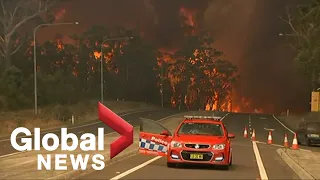Raging Australian wildfires force residents to water's edge