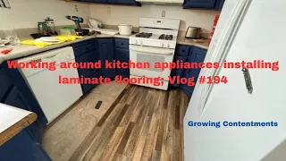 Working around kitchen appliances installing laminate flooring; Vlog #194