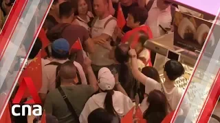 Scuffles between rival protesters at Hong Kong shopping mall