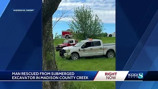 Excavator operator rescued after machine overturns in Madison County creek