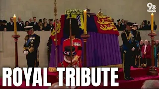 Queen's four children gather around her coffin in silent tribute