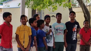 Young kids singing a Telugu folk song at the Celebration of Learning event