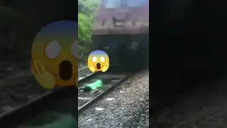 😱 Just Miss😲..!!!#train #accident train stunt| Man lying on railway track|train speeds over him|risk