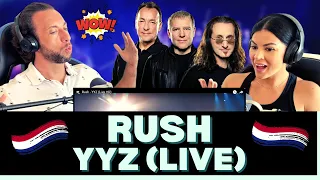 PLAYING THE BASS LIKE WE"VE NEVER SEEN BEFORE! First Time Hearing Rush - YYZ (Live) Reaction!