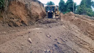 Outstanding Work CATERPILLAR BULLDOZER D6R XL smoothing a new breakthrough road on the mountain