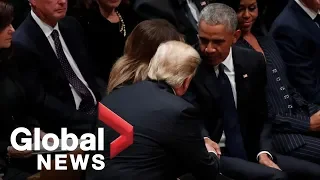 Bush funeral: Obamas greet Trumps with handshakes inside National Cathedral