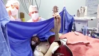 Patient plays Beatles on guitar during brain surgery