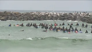 Hundreds gathered at Ocean Beach Dog Beach for paddle out to remember killed surfers