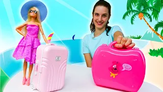 Barbie et Ken vont à la plage. Faisons la valise. Vidéo en français pour les filles.