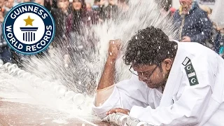 Most drinks cans crushed with the elbow in one minute - Guinness World Records