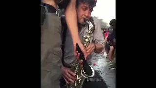 Playing Giorno's theme on sax during protests | (REUPLOAD)