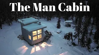 MAN ALONE IN CABIN. THEN WOMAN AND DOG