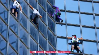 'Spider man' scales tower in world first in protest at French health pass